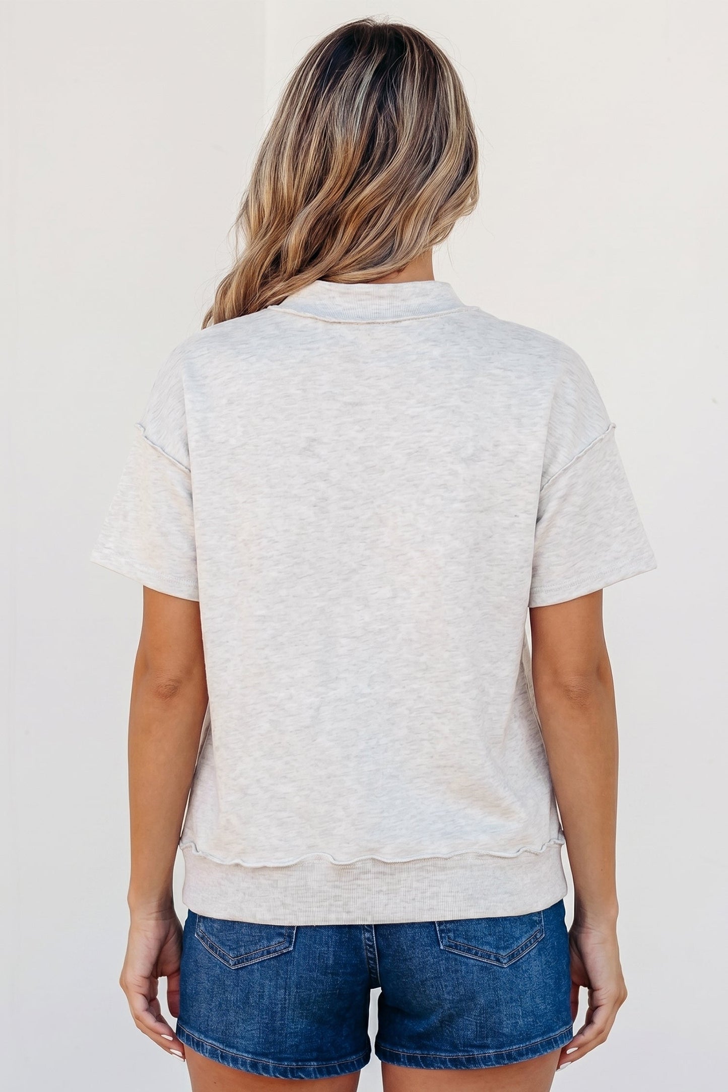 Solid Exposed Seam Mock Neck Tee